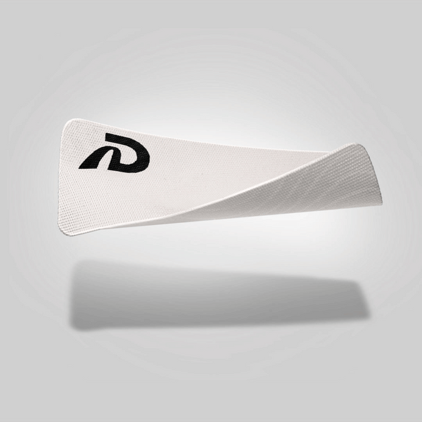 A piece of white mouth tape with a black logo on the upper left corner, presented against a grey background.